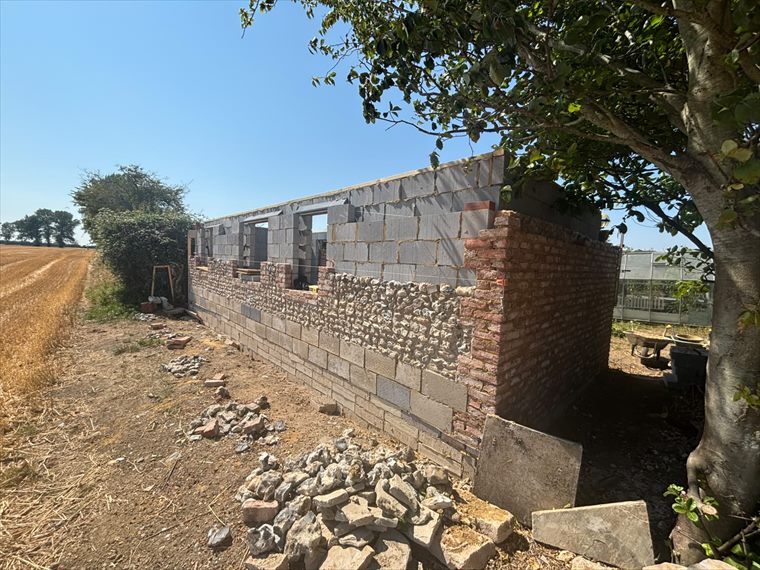 New blockwork alongside the original walls