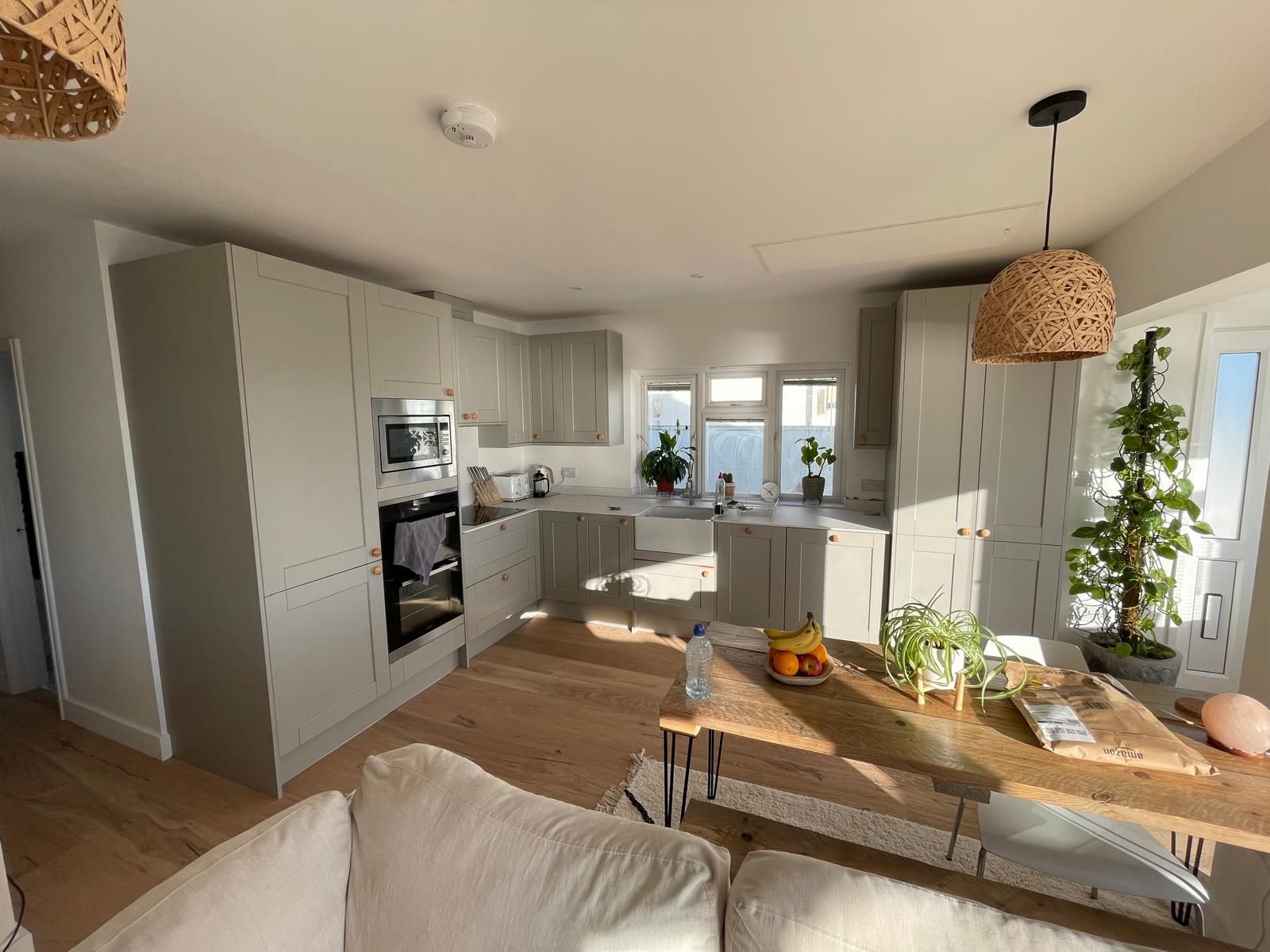 Finished open-plan kitchen and living space in the coastal home