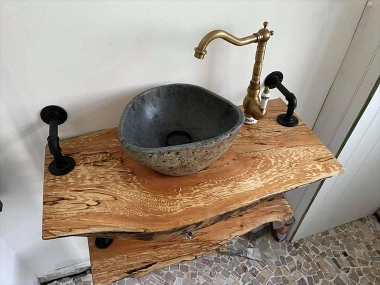 Stone basin on solid timber shelving