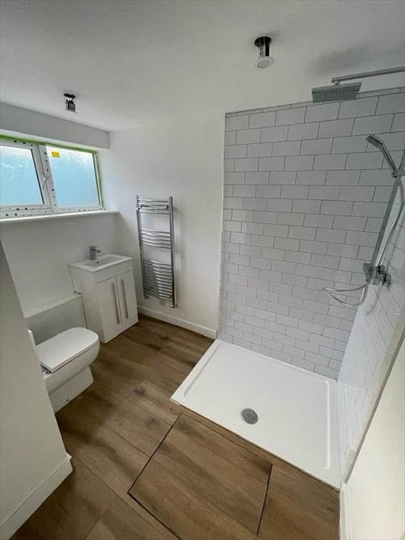 Shower room with heated towel rail