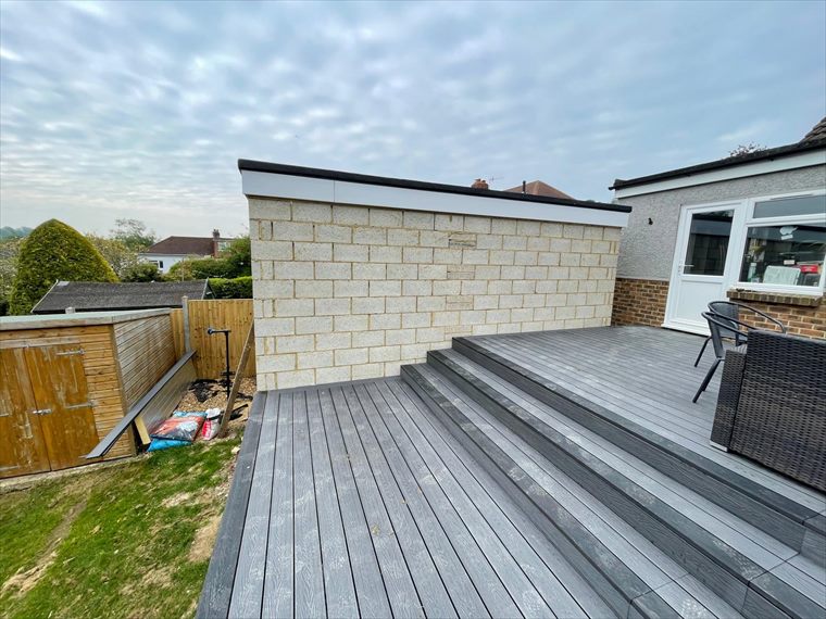 Decking with wide steps down to the garden