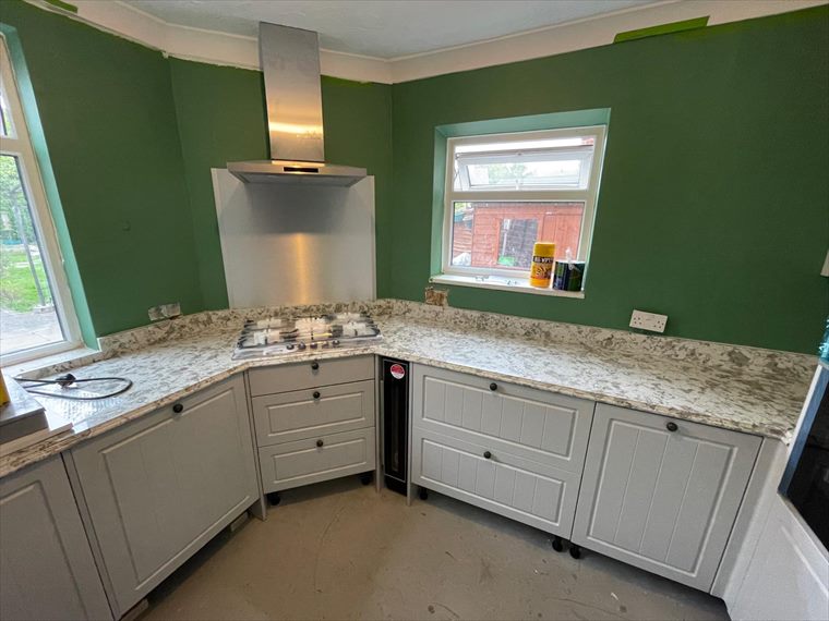 Shaker-style kitchen with stone-effect worktops