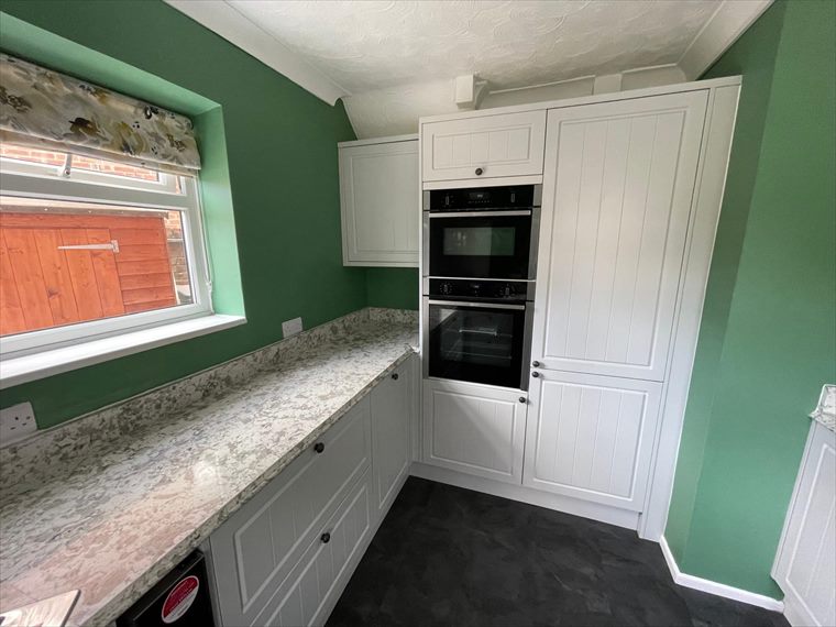 Integrated ovens in a classic shaker kitchen